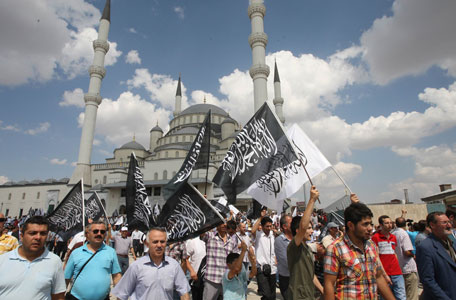 Supporters of unseated Egypt's Islamist president Mohamed Morsi demonstrate outside the Kocatepe Mos