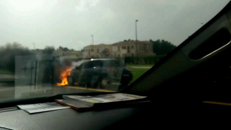 Car on fire on Sheikh Zayed Road in Dubai; cop puts blaze out ...