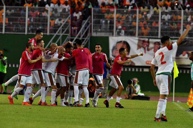 Morocco's team players celebrate at the Felix Houphouet-Boigny stadium in Abidjan
