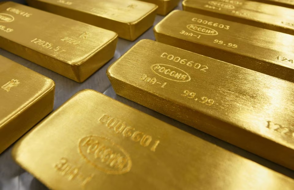 PRECIOUS-Gold dips, softer dollar limits losses